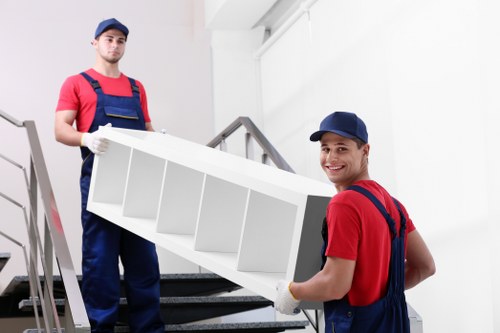 Local Manorhouse movers organizing boxes during a home packing service
