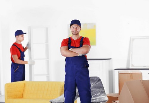 Professional flat removals planning in Manorhouse with moving boxes and access preparation