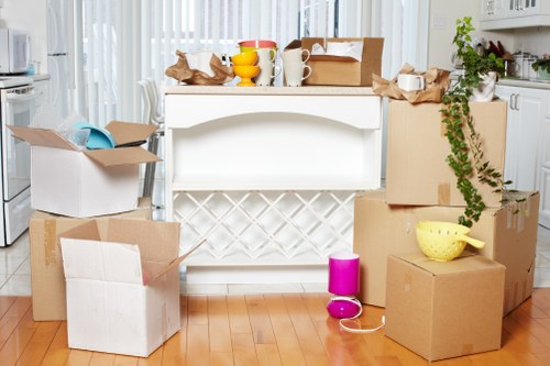 Unpacking and organizing household items after a move in Manorhouse
