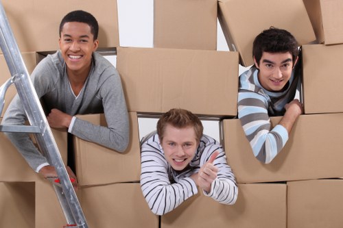Mover wearing PPE while lifting items safely