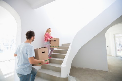 Removal team transporting household items safely